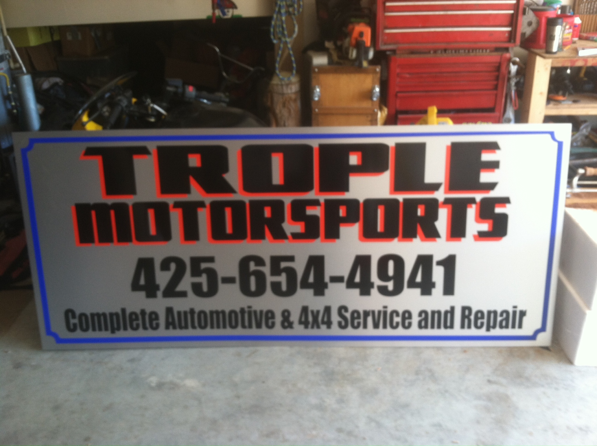 die-cut graphics on brushed metal alupanel for Trople Motorsports of Everett, wa